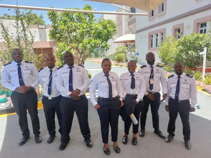 TrustForce Security — a professional, mixed security team including female security officers deployed on site in Qatar. TrustForce provides female security guards for healthcare, hospitality, education, and event environments across Doha.
