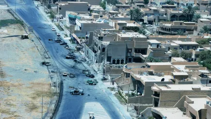 Aerial view of a blast-damaged urban street in a conflict-affected region, illustrating the volatile high-risk environments in which TrustForce Security provides specialist diplomatic security and protective services for embassies, government personnel, and corporate clients operating internationally.